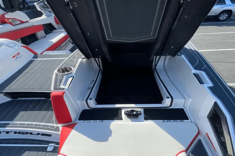 Slide: The Image of 2023 Nautique Super Air Nautique G25 Paragon boat interior with open storage compartment. - 14