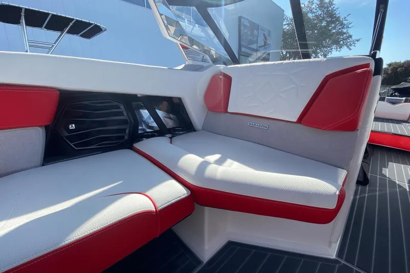 Slide: The Image of Interior seating of 2023 Nautique Super Air Nautique G25 Paragon boat with red and white upholstery. - 25