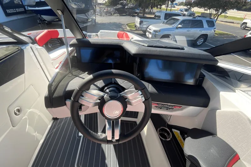 Slide: The Image of 2023 Nautique Super Air Nautique G25 Paragon dashboard with steering wheel and digital displays. - 35