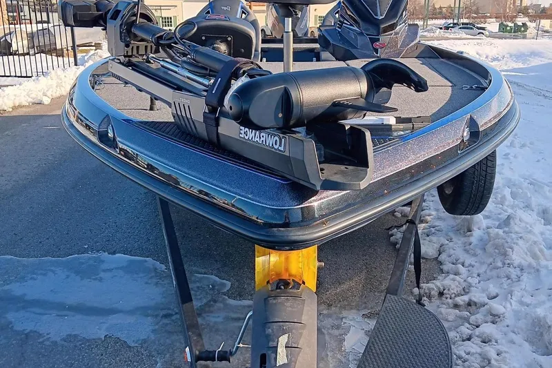 Slide: The Image of 2024 Ranger Z520R Ranger Cup Equipped boat on a snowy driveway. - 2