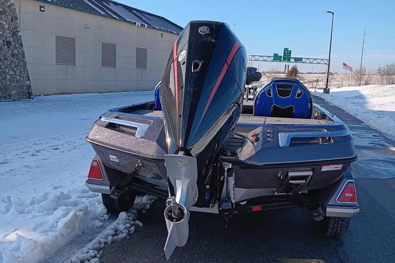 Slide: The Image of 2024 Ranger Z520R Ranger Cup Equipped boat, rear view, parked on snowy pavement. - 3