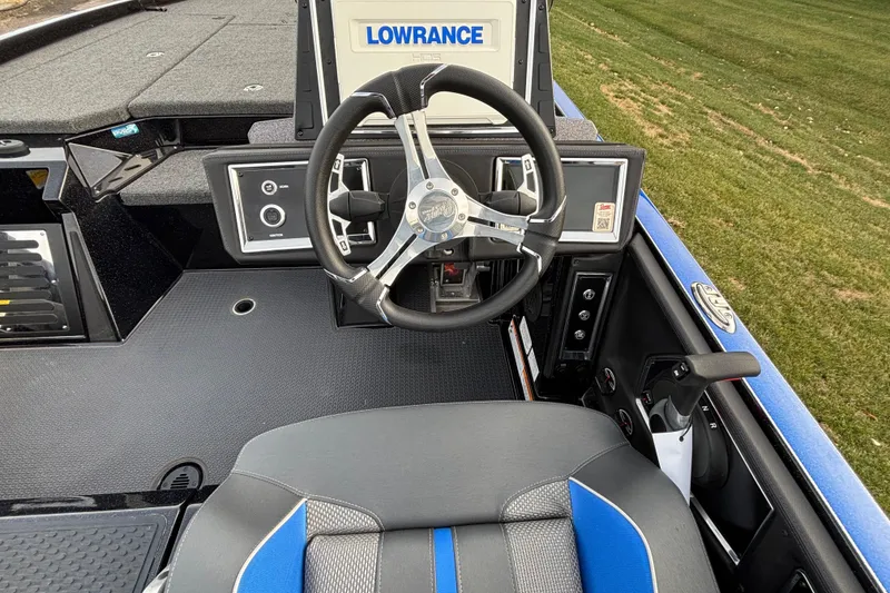 Slide: The Image of 2024 Ranger Z520R Ranger Cup boat cockpit with steering wheel and Lowrance display. - 64