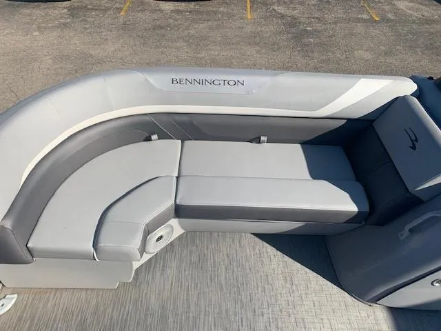 Slide: The Image of 2023 Bennington SX Line boat seating with gray upholstery and sleek design. - 10