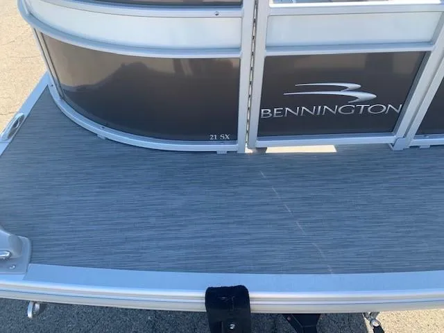 Slide: The Image of 2023 Bennington SX Line boat deck with logo and sleek design. - 11