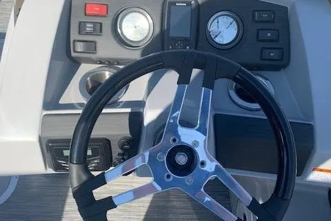 Slide: The Image of Steering wheel and dashboard of 2023 Bennington SX Line boat. - 14