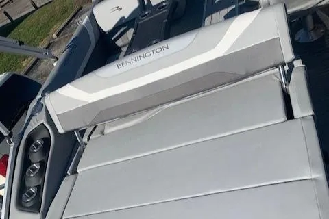 Slide: The Image of 2023 Bennington SX Line boat with luxurious seating and sleek design. - 18