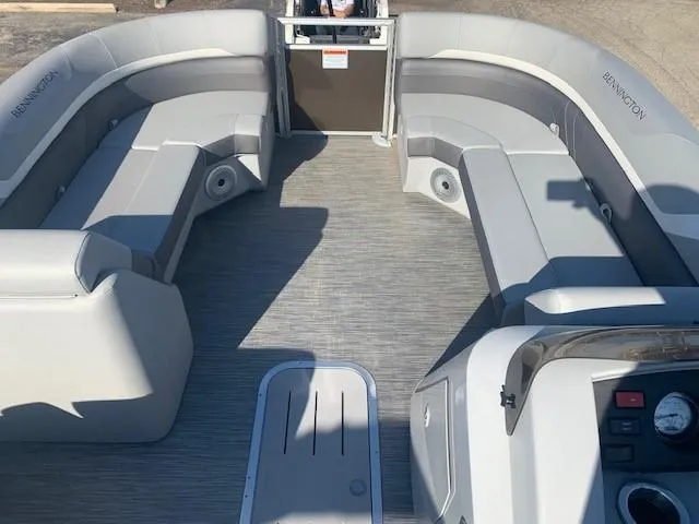 Slide: The Image of 2023 Bennington SX Line boat interior with gray seating and modern design. - 8