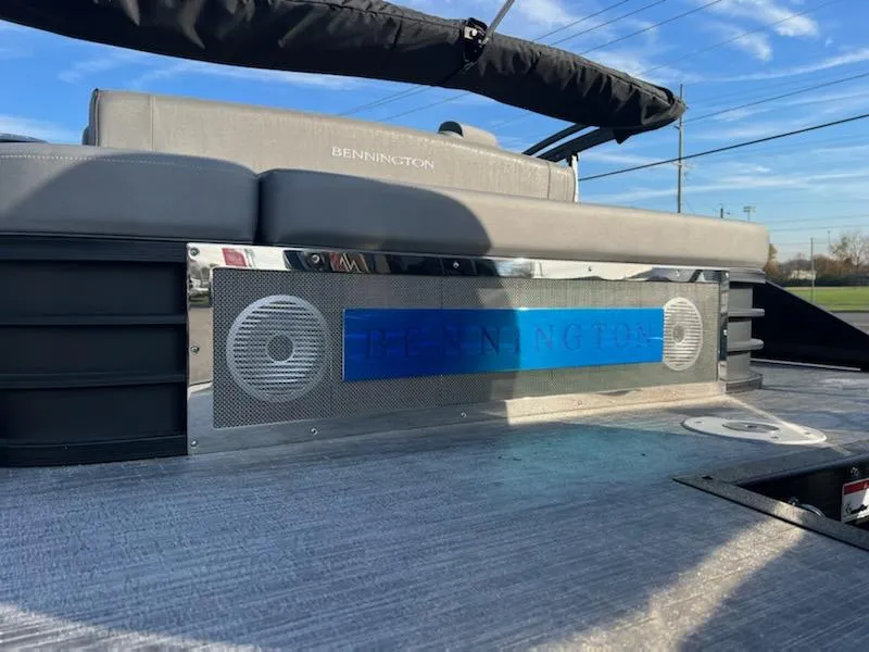 Slide: The Image of 2023 Bennington LX Sport Line boat with premium seating and built-in speakers. - 6