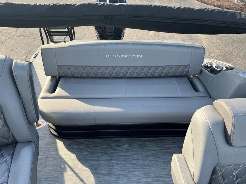 Slide: The Image of 2023 Bennington LX Sport Line boat with gray seating and cup holders. - 8