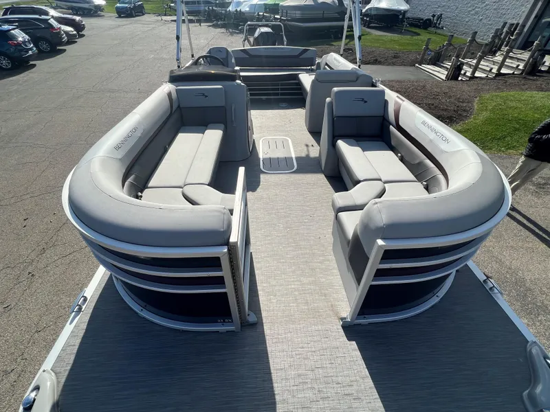 Slide: The Image of 2023 Bennington SX Line pontoon boat with spacious seating and modern design. - 4
