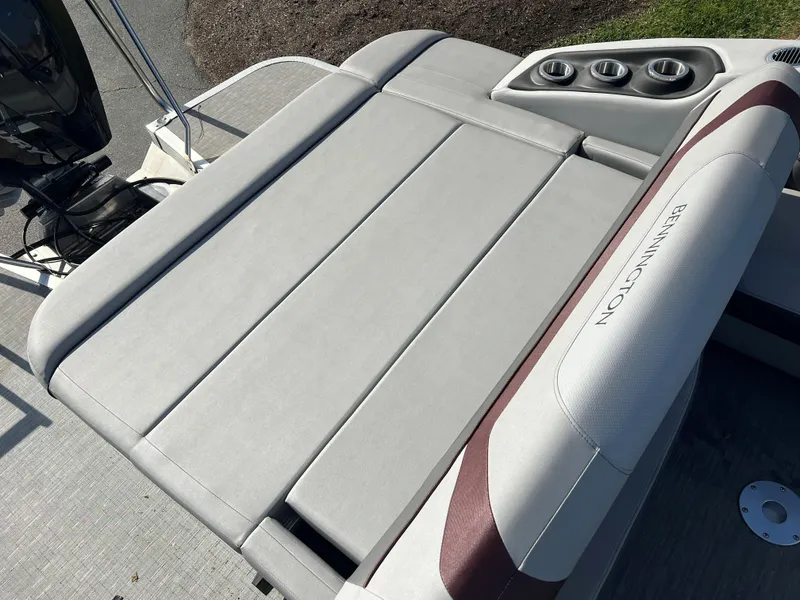 Slide: The Image of 2023 Bennington SX Line boat with luxurious seating and cup holders. - 6