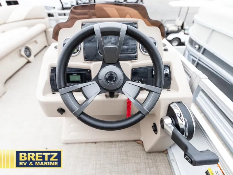Slide: The Image of Steering wheel and control panel of 2023 Sport 85 - 25 FT boat by Bretz RV & Marine. - 13