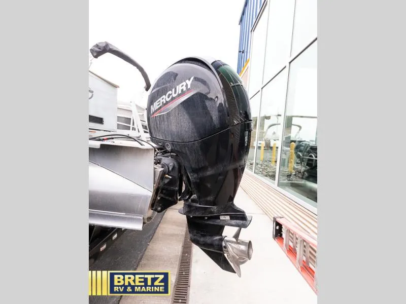 Slide: The Image of Mercury outboard motor on a 2023 Sport 85 - 25 FT boat at Bretz RV & Marine. - 6