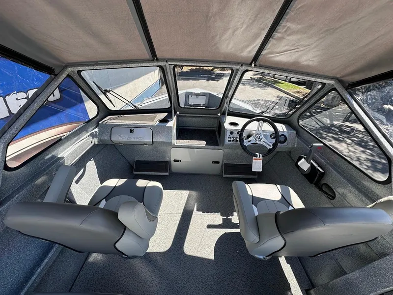 Slide: The Image of Interior of 2024 KingFisher 1825 Falcon boat with dual seats and steering console. - 13