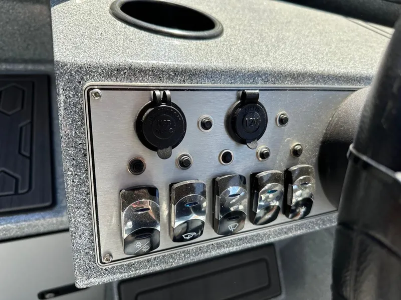 Slide: The Image of Dashboard controls of 2024 KingFisher 1825 Falcon boat with switches and ports. - 18
