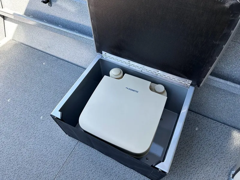 Slide: The Image of Portable toilet in 2024 KingFisher 1825 Falcon boat interior. - 28