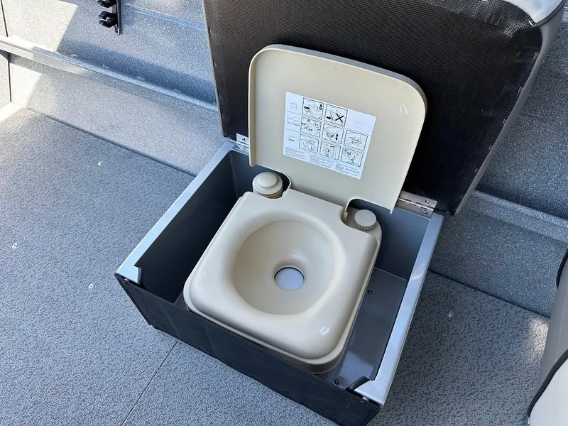 Slide: The Image of Portable toilet on 2024 KingFisher 1825 Falcon boat deck. - 29