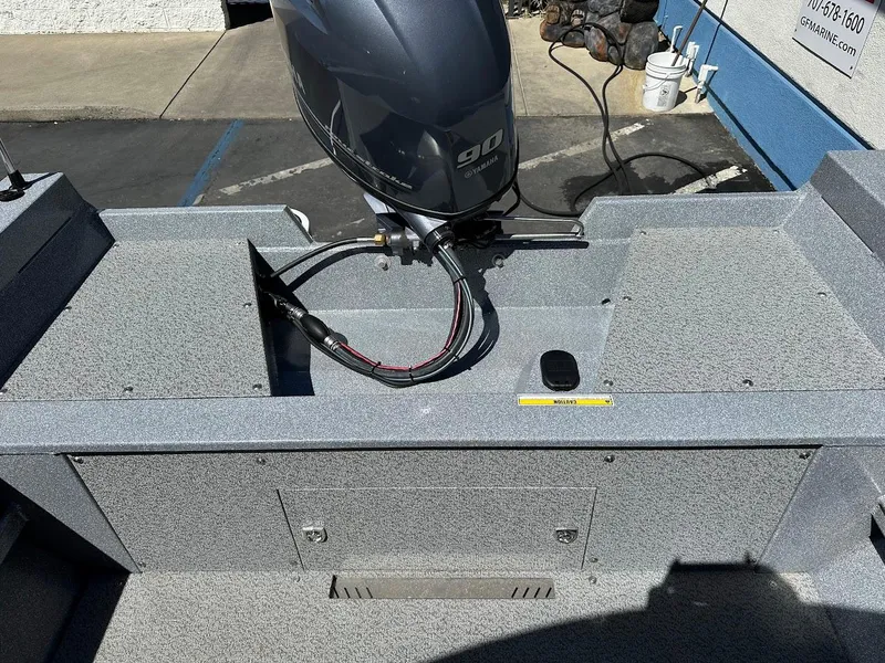 Slide: The Image of 2024 KingFisher 1825 Falcon boat with 90 HP outboard motor, rear view. - 32