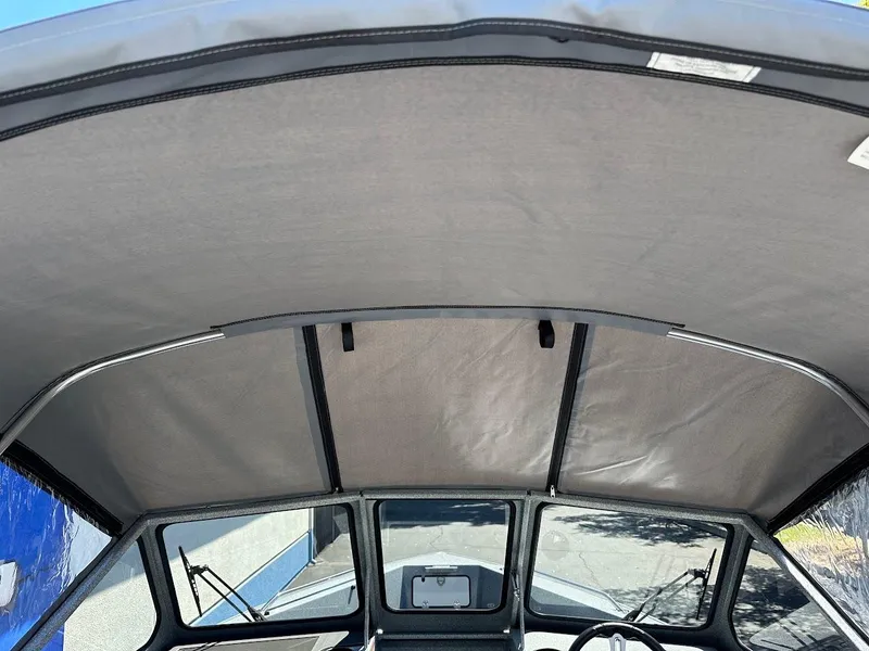 Slide: The Image of Interior view of 2024 KingFisher 1825 Falcon boat canopy and windshield. - 36