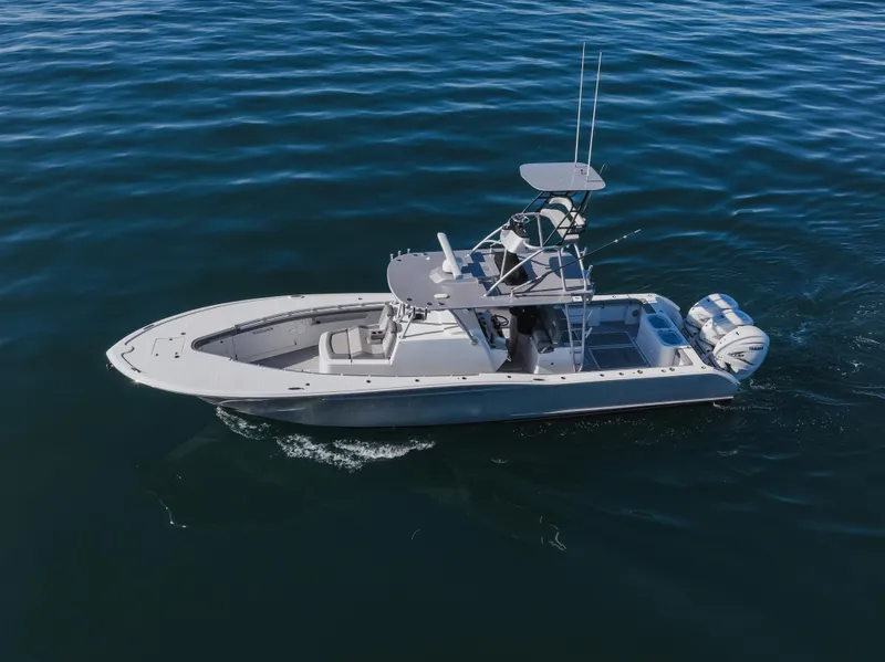 Slide: The Image of 2019 Buddy Davis 42 CC boat cruising on open water, aerial view. - 10