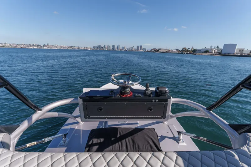 Slide: The Image of 2019 Buddy Davis 42 CC boat helm with ocean and city skyline view. - 14