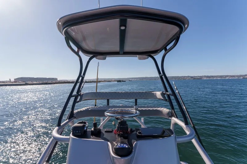 Slide: The Image of 2019 Buddy Davis 42 CC boat helm with ocean view and clear sky. - 15
