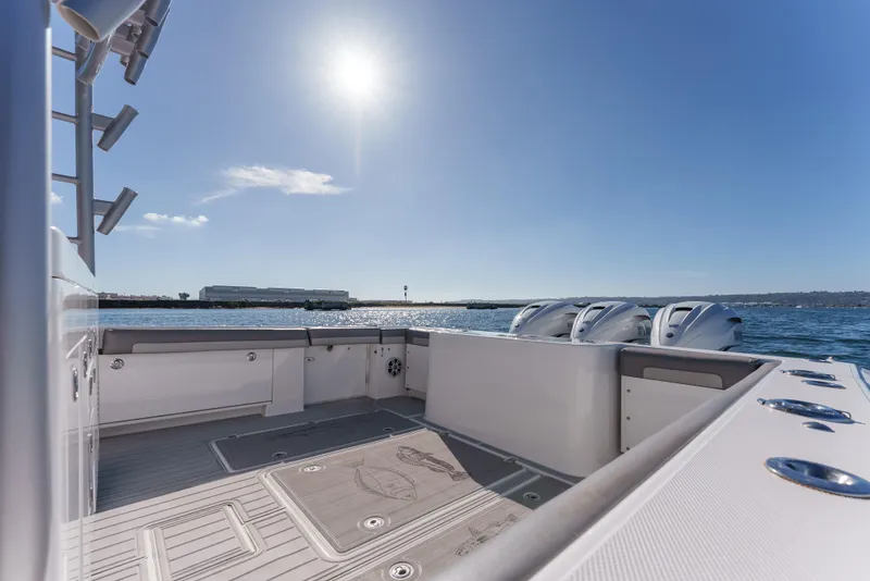 Slide: The Image of 2019 Buddy Davis 42 CC boat deck with ocean view and clear sky. - 18