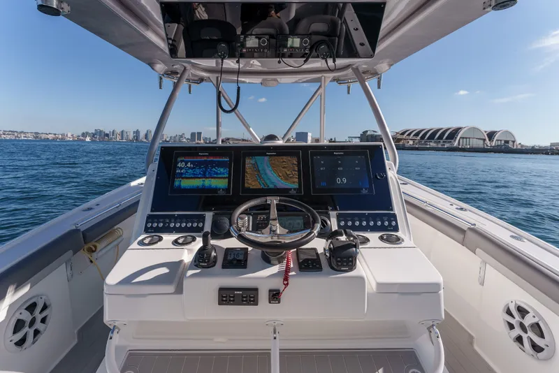 Slide: The Image of Cockpit view of 2019 Buddy Davis 42 CC boat with advanced navigation systems. - 22
