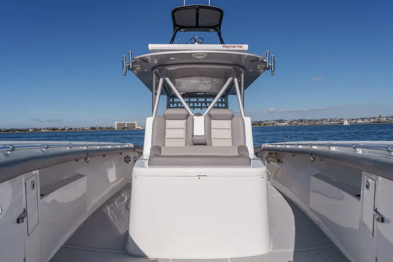 Slide: The Image of 2019 Buddy Davis 42 CC boat on water, featuring sleek design and spacious seating. - 25