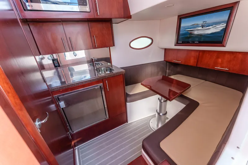 Slide: The Image of Luxurious interior of 2019 Buddy Davis 42 CC boat with kitchenette and seating area. - 27