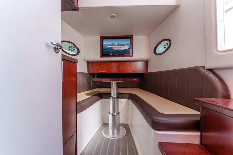 Slide: The Image of 2019 Buddy Davis 42 CC cabin interior with seating, table, and nautical decor. - 28