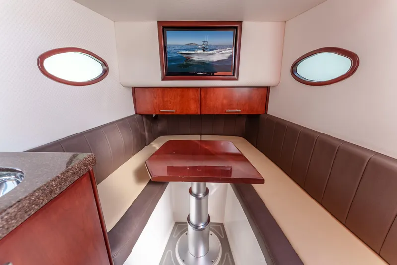 Slide: The Image of 2019 Buddy Davis 42 CC cabin interior with seating, table, and wall art. - 29