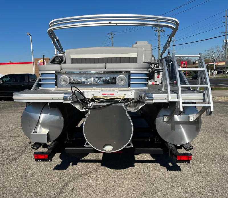 Slide: The Image of 2023 Bennington L Line pontoon boat rear view with ladder and seating. - 11