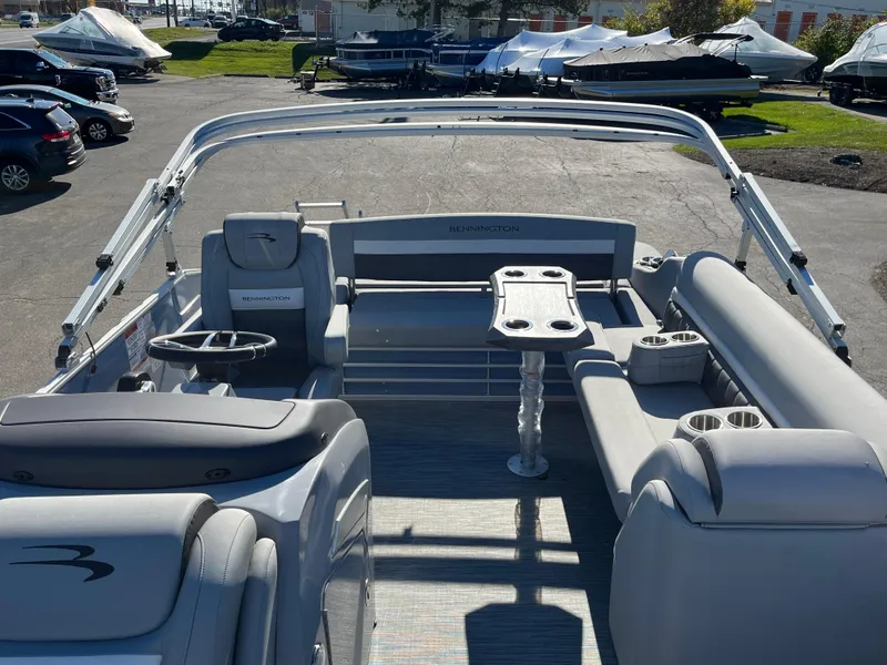 Slide: The Image of 2023 Bennington L Line pontoon boat interior with seating and table. - 3