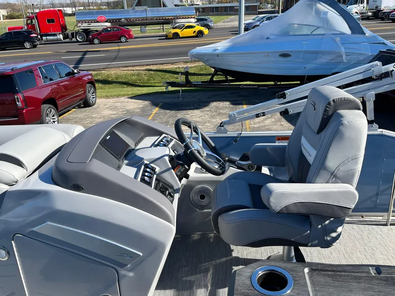 Slide: The Image of 2023 Bennington L Line boat interior with captain's chair and control console. - 5