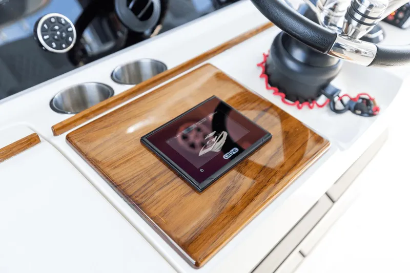 Slide: The Image of Control panel of 2024 Aquila 47 Molokai with touchscreen and steering wheel. - 10