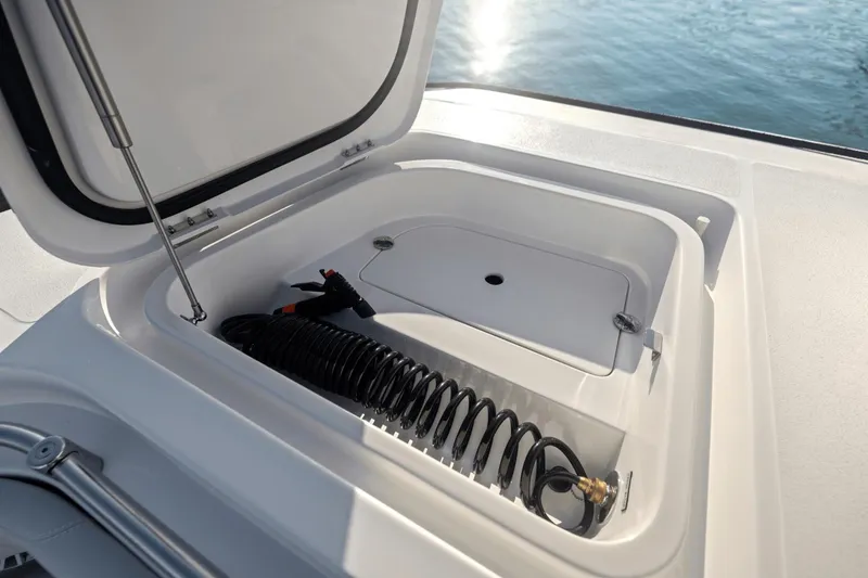 Slide: The Image of Storage compartment with coiled hose on 2024 Aquila 47 Molokai boat. - 11