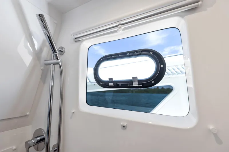 Slide: The Image of Shower area with window on 2024 Aquila 47 Molokai yacht. - 19