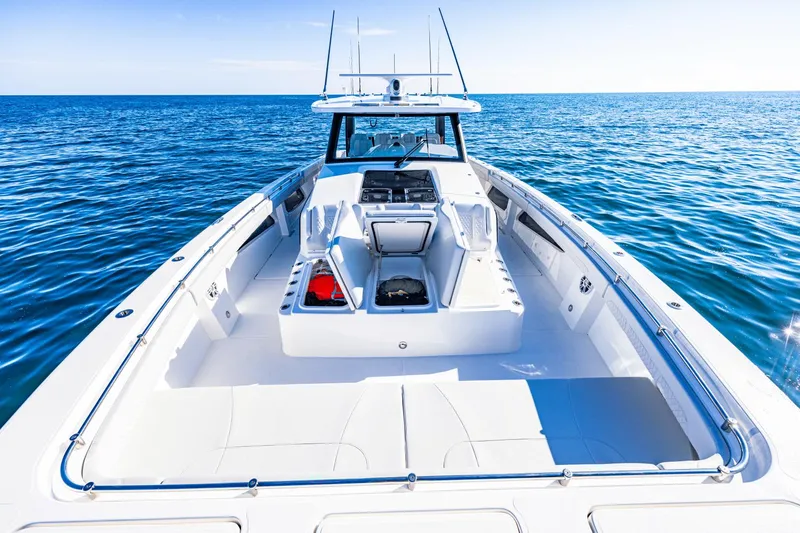 Slide: The Image of 2024 Aquila 47 Molokai boat on open water, spacious deck and storage compartments. - 2