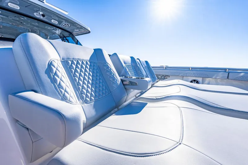 Slide: The Image of Luxurious seating on the 2024 Aquila 47 Molokai yacht under a bright sun. - 24