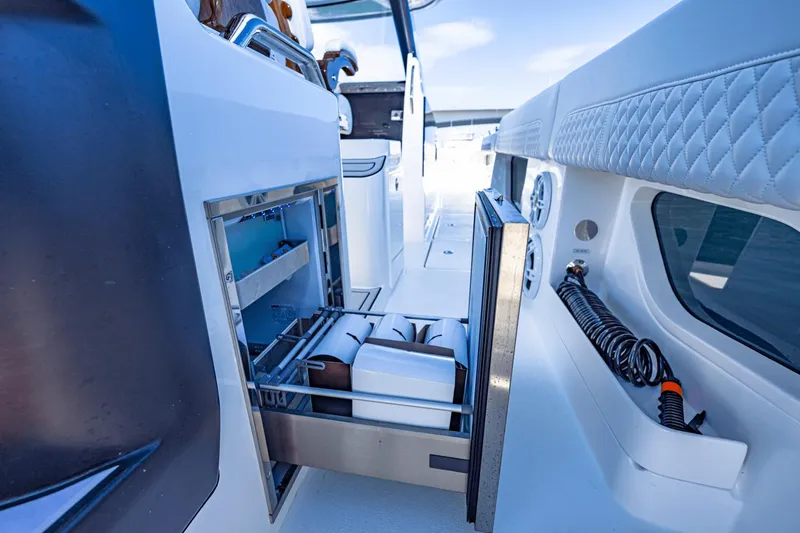 Slide: The Image of Built-in storage drawer on the 2024 Aquila 47 Molokai boat. - 25
