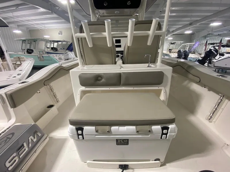 Slide: The Image of 2024 Key West 263 FS boat interior with seating and storage. - 10