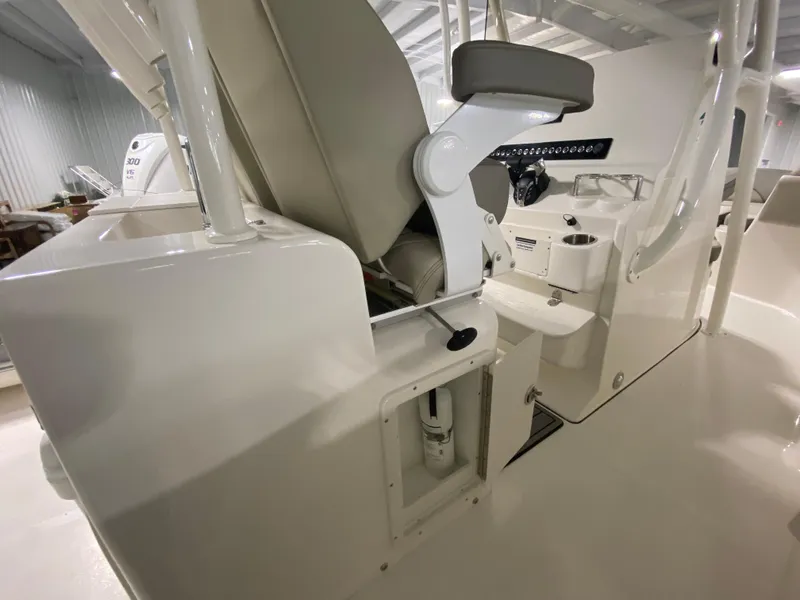 Slide: The Image of 2024 Key West 263 FS boat interior, featuring helm seating and control panel. - 14