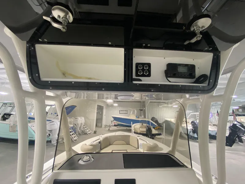 Slide: The Image of 2024 Key West 263 FS boat interior with console and storage compartments. - 19