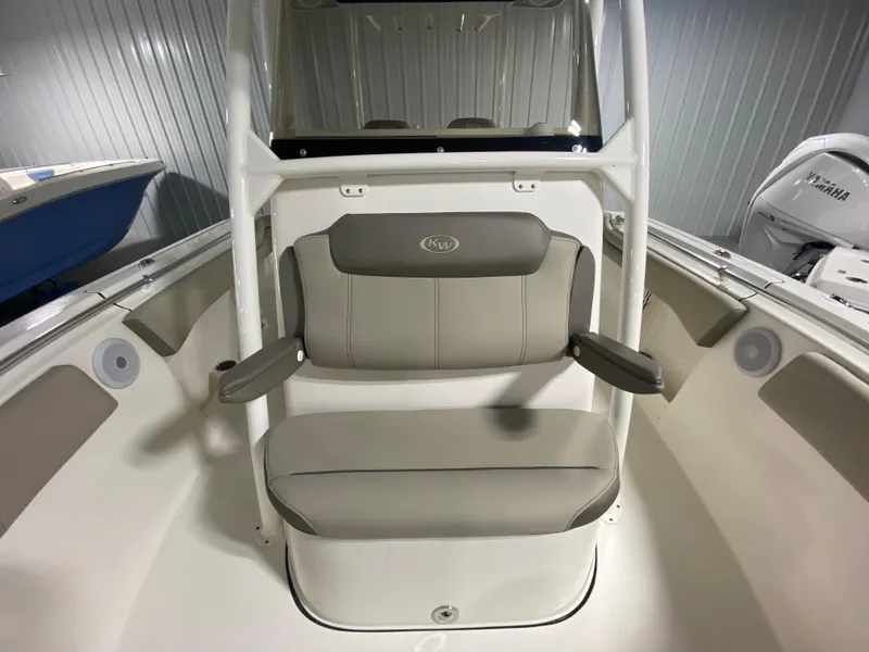 Slide: The Image of 2024 Key West 263 FS boat interior with cushioned seating and armrests. - 21