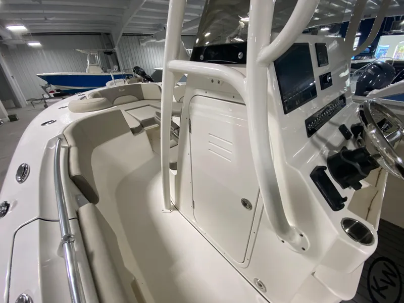 Slide: The Image of 2024 Key West 263 FS boat interior with helm and seating area. - 24