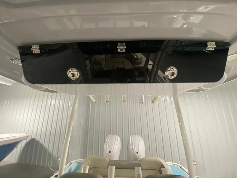 Slide: The Image of 2024 Key West 263 FS boat interior with overhead storage compartment. - 26