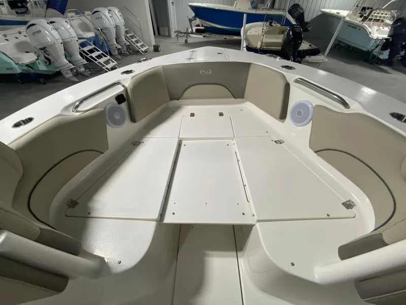 Slide: The Image of 2024 Key West 263 FS boat interior with seating and storage compartments. - 27
