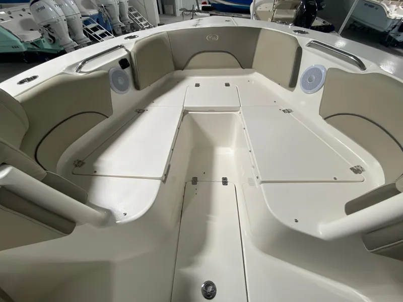 Slide: The Image of 2024 Key West 263 FS boat interior with spacious seating and storage compartments. - 29