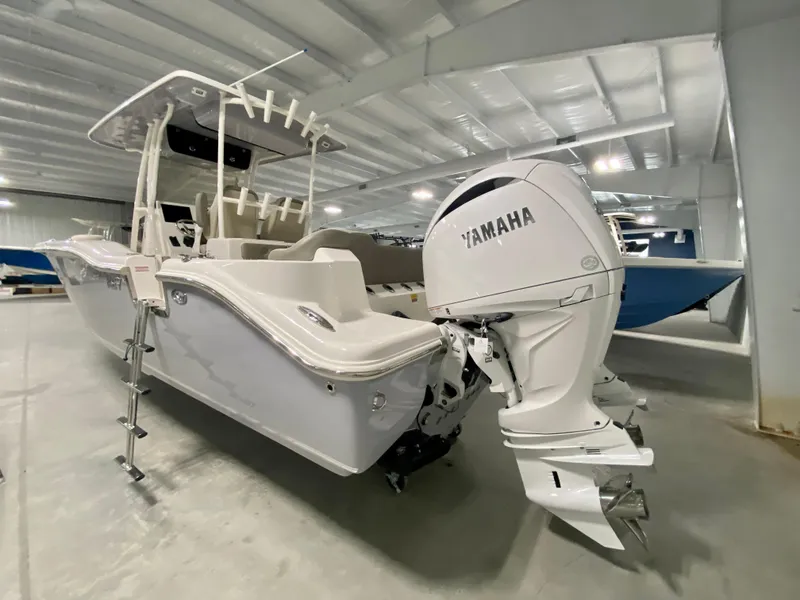 Slide: The Image of 2024 Key West 263 FS boat with Yamaha outboard motor in showroom. - 3